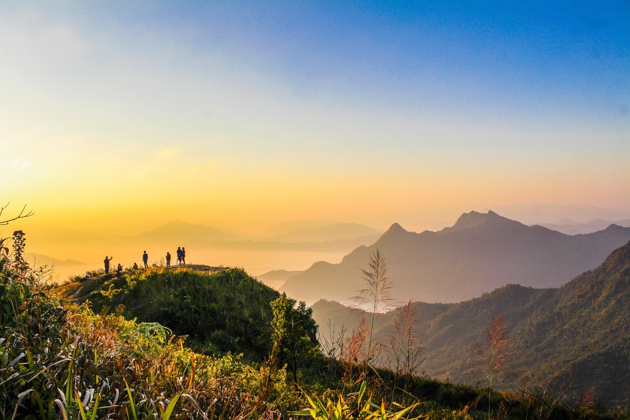 inicio Photo Of People Standing On Top Of Mountain Near Grasses 733162
